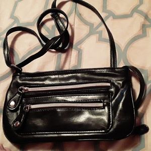 Little black purse two zippers in the front zipper in the in the back